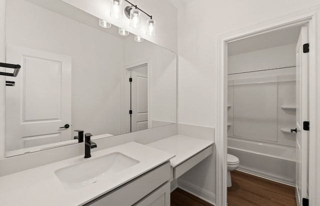 3813 Gabriels Horn Rd, Leander, TX 78641 - bathroom with toilet, vanity, wood finished floors, and shower / washtub combination