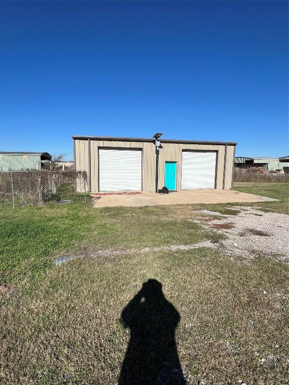 garage featuring a yard