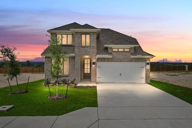 409 Raleigh Dr, Georgetown, TX 78633 - view of front of home featuring brick siding, concrete driveway, a garage, and roof with shingles