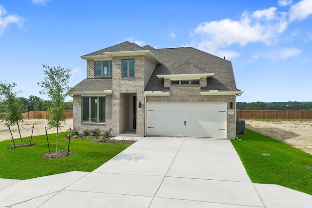 409 Raleigh Dr, Georgetown, TX 78633 - view of front of home featuring brick siding, concrete driveway, roof with shingles, and a garage