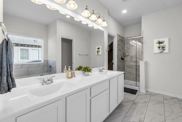 bathroom with vanity and an enclosed shower