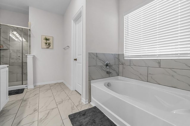 bathroom featuring shower with separate bathtub