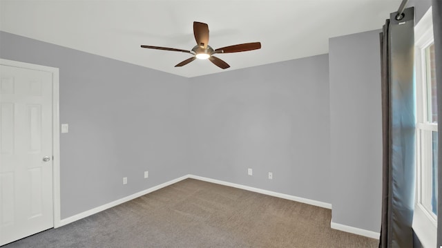 carpeted empty room with ceiling fan