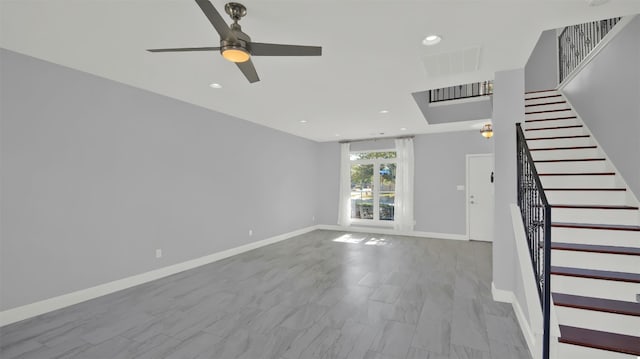 unfurnished living room featuring ceiling fan