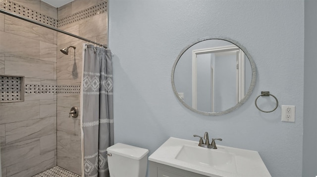 bathroom featuring a shower with curtain, vanity, and toilet