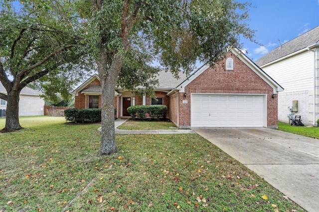 view of front of house featuring a garage and a front yard