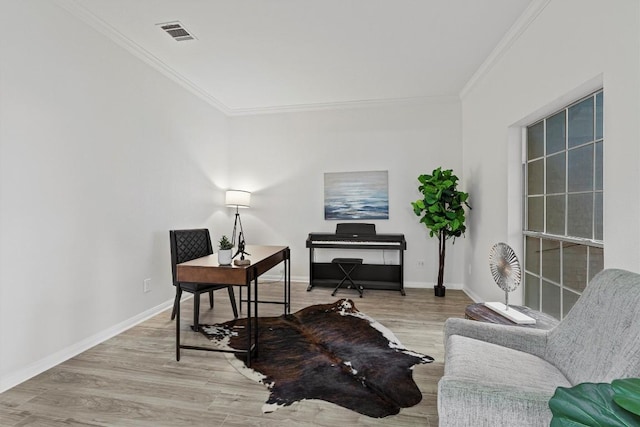 office featuring light hardwood / wood-style floors and ornamental molding