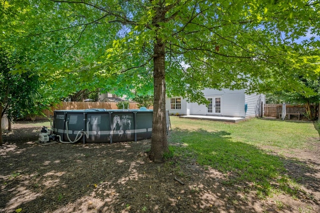 view of yard featuring french doors