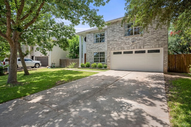 view of front facade featuring a garage and a front lawn