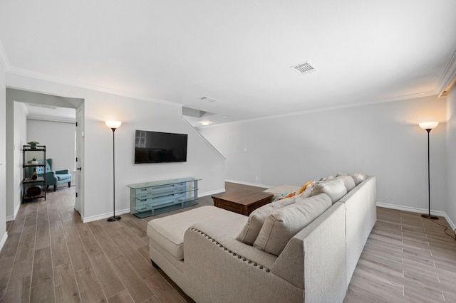 living room with crown molding and light hardwood / wood-style flooring