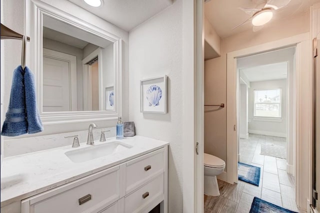 bathroom featuring vanity and toilet