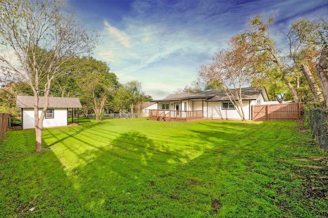 view of yard with a shed and a deck