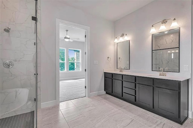 bathroom featuring a tile shower, ceiling fan, and vanity