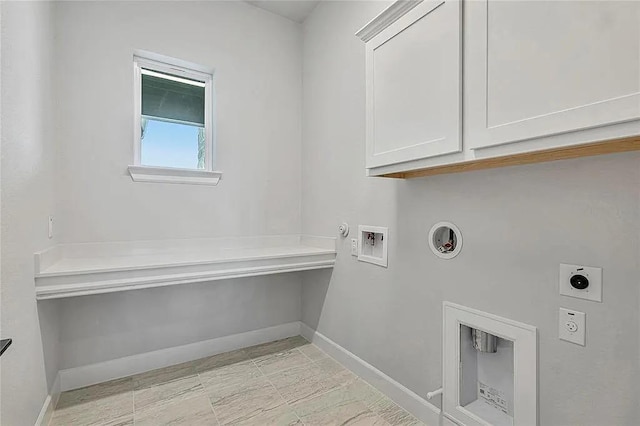 laundry area with electric dryer hookup, gas dryer hookup, cabinets, and washer hookup