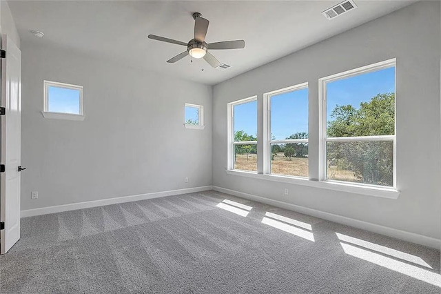 empty room featuring carpet and ceiling fan