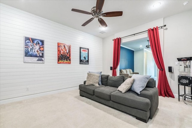 carpeted living room with visible vents and a ceiling fan