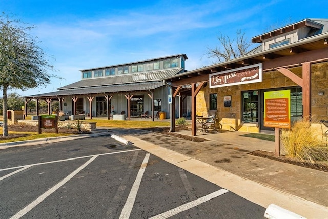 view of property featuring uncovered parking