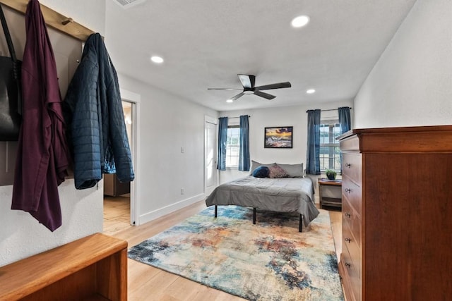 bedroom featuring light hardwood / wood-style floors and ceiling fan