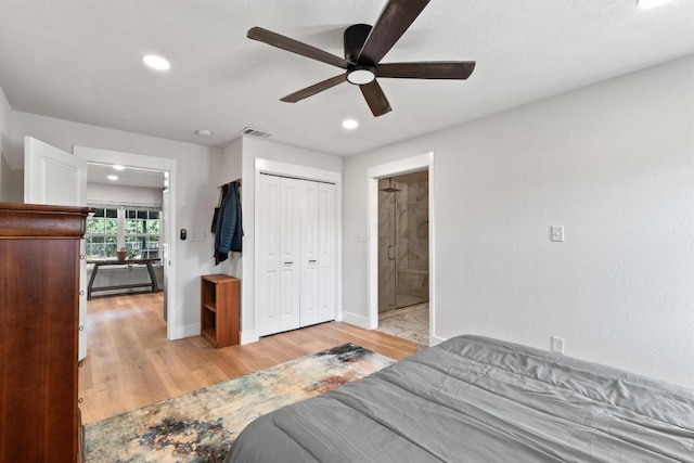 bedroom with ceiling fan, light wood-type flooring, connected bathroom, a baseboard radiator, and a closet