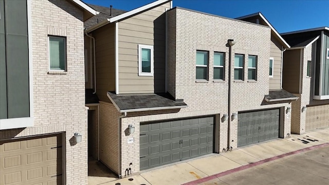 view of side of property featuring a garage