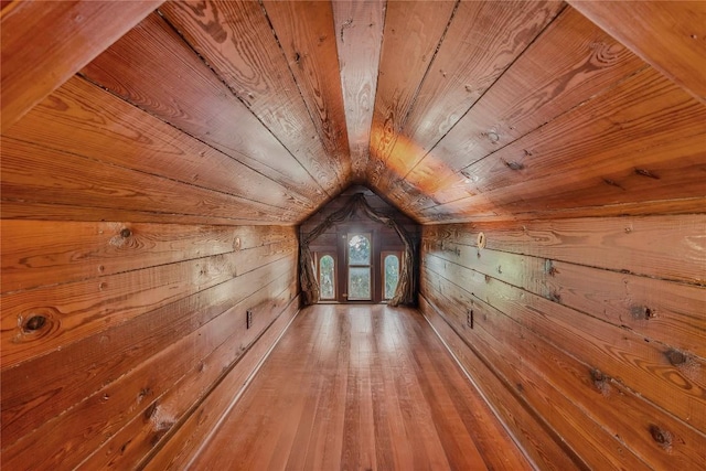 524 Saint Peter St, Gonzales, TX 78629 - hall with wood walls, wooden ceiling, lofted ceiling, and hardwood / wood-style flooring