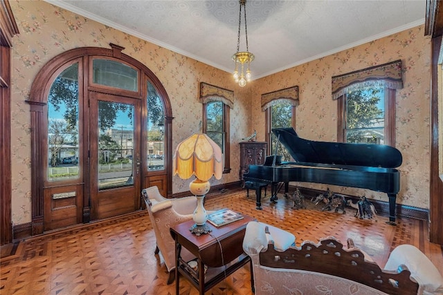 living area featuring parquet floors, ornamental molding, an inviting chandelier, and a textured ceiling