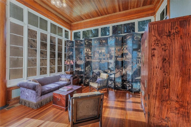 sitting room with wood-type flooring and wooden ceiling