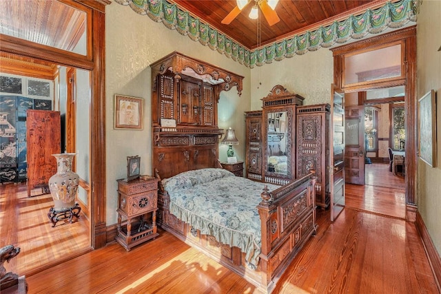 bedroom featuring wood ceiling, ceiling fan, and hardwood / wood-style flooring