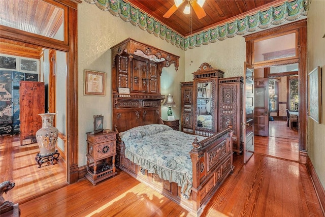 524 Saint Peter St, Gonzales, TX 78629 - bedroom featuring wooden ceiling, hardwood / wood-style flooring, and a textured wall