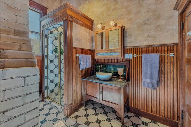 524 Saint Peter St, Gonzales, TX 78629 - bathroom featuring vanity, wainscoting, and wooden walls
