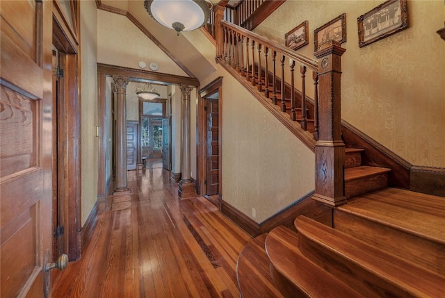 524 Saint Peter St, Gonzales, TX 78629 - staircase featuring hardwood / wood-style flooring and decorative columns