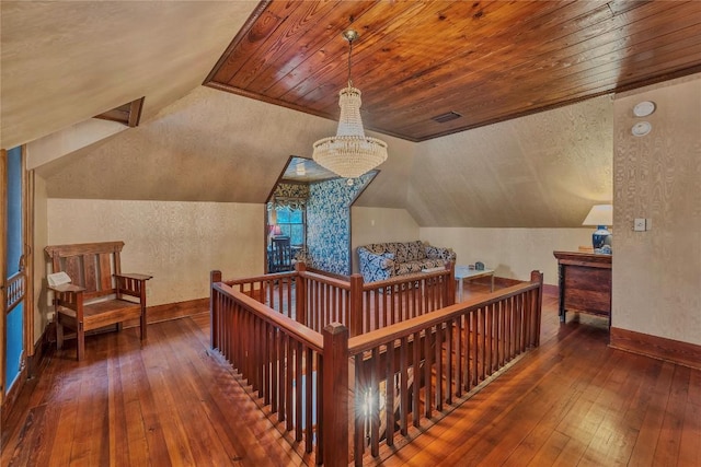 524 Saint Peter St, Gonzales, TX 78629 - corridor with hardwood / wood-style flooring, an upstairs landing, lofted ceiling, a chandelier, and wooden ceiling