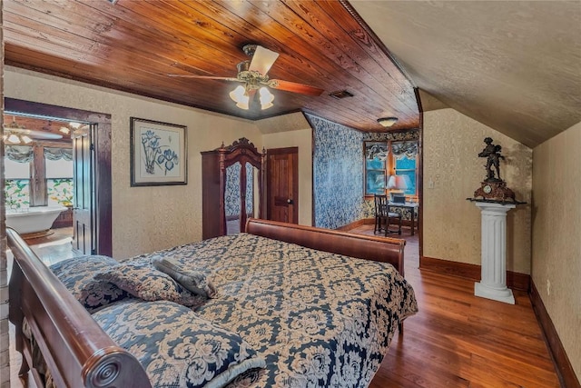 524 Saint Peter St, Gonzales, TX 78629 - bedroom with wood ceiling, wood finished floors, a textured wall, and a ceiling fan