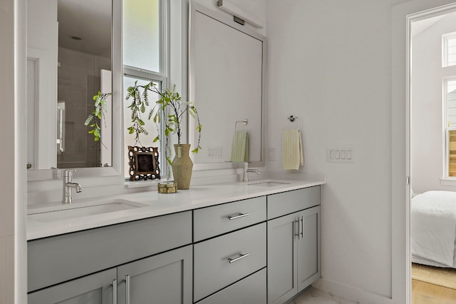 bathroom with vanity and a wealth of natural light