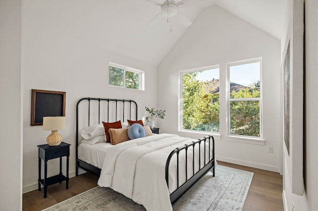 bedroom with hardwood / wood-style floors, ceiling fan, and lofted ceiling