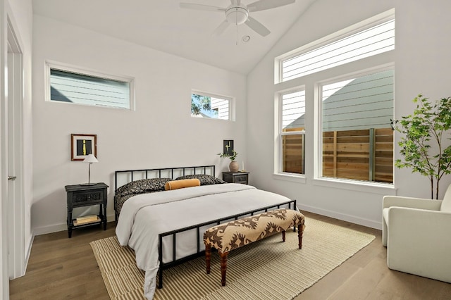 bedroom with wood-type flooring, ceiling fan, and lofted ceiling