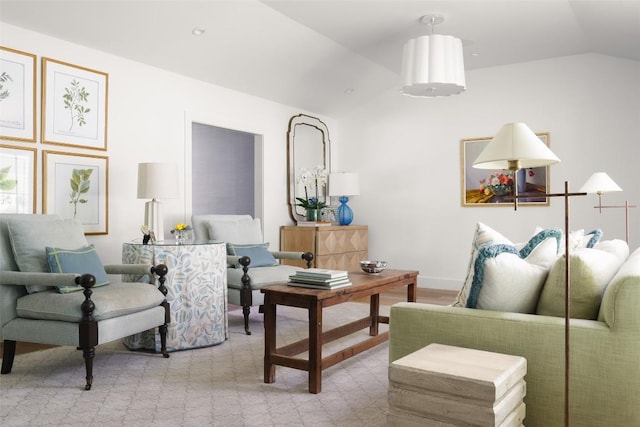 sitting room with lofted ceiling