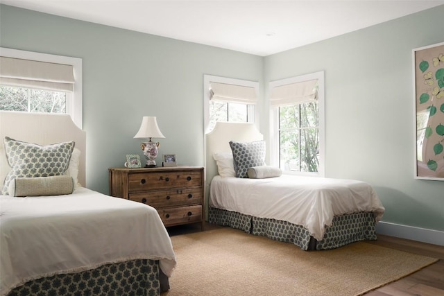 bedroom with hardwood / wood-style flooring