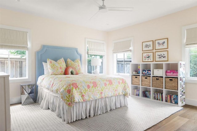 bedroom with wood-type flooring and ceiling fan