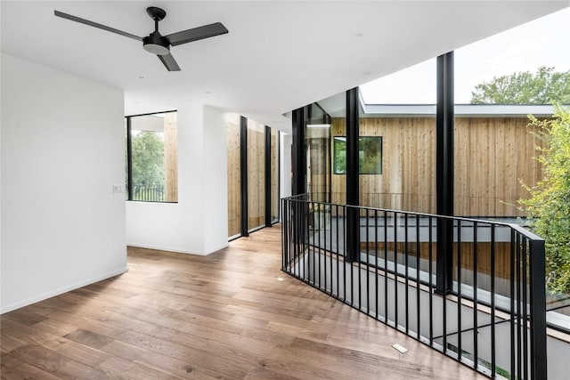 view of gate featuring ceiling fan