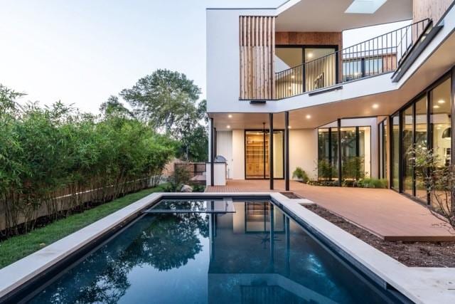 view of pool featuring a fenced in pool, a patio area, and fence