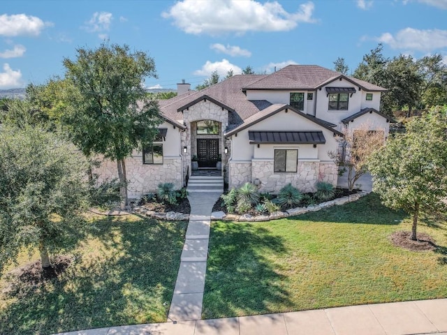 view of front of house featuring a front lawn