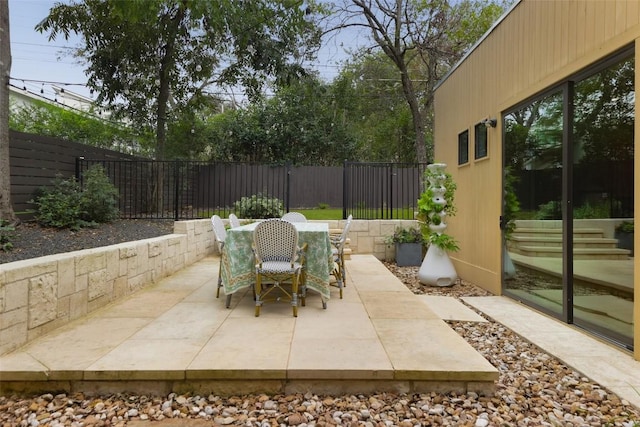 view of patio / terrace featuring outdoor dining space and a fenced backyard