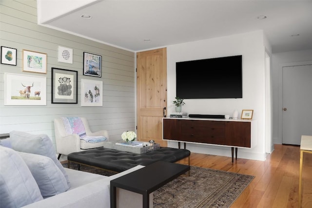 living room featuring recessed lighting and hardwood / wood-style flooring