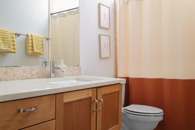 bathroom with curtained shower, tasteful backsplash, vanity, and toilet