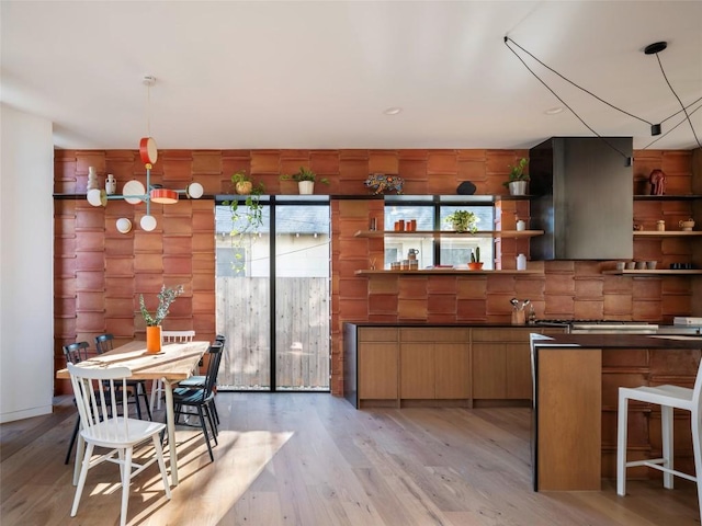 kitchen featuring decorative light fixtures and light wood-type flooring