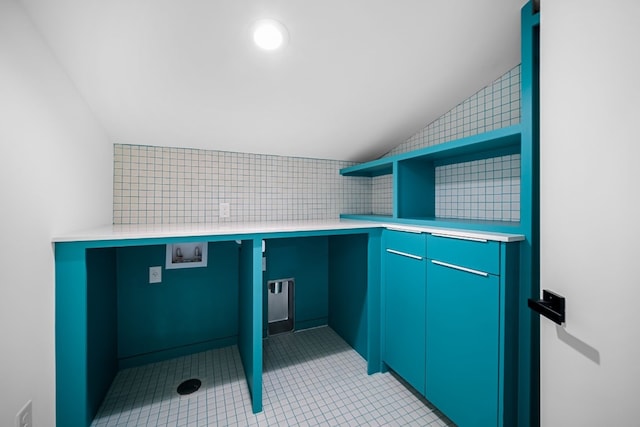 laundry room with cabinets, hookup for a washing machine, and light tile patterned flooring