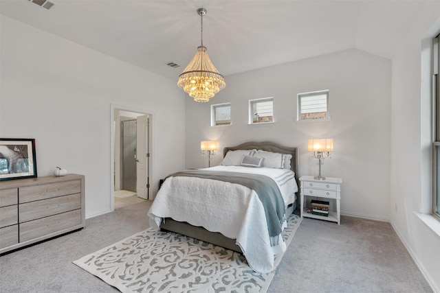 bedroom with vaulted ceiling, light colored carpet, and a notable chandelier