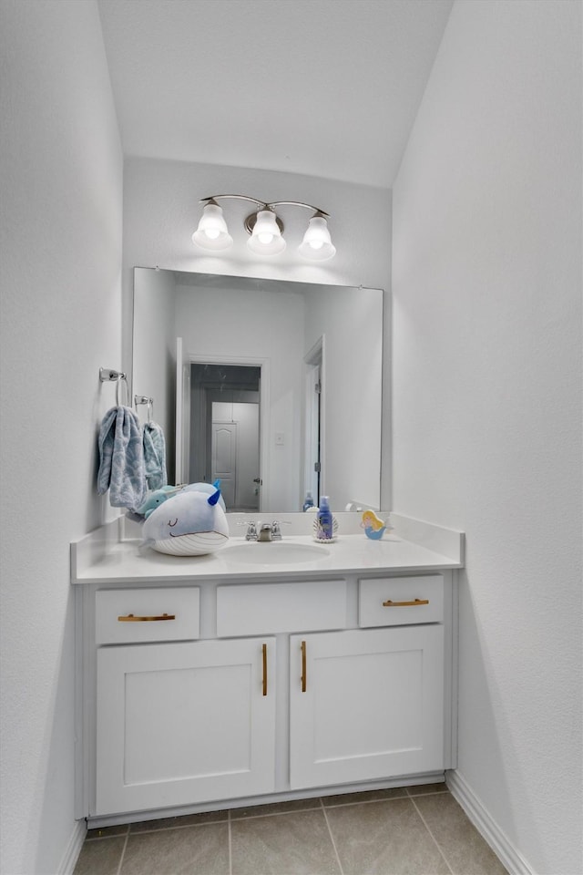 bathroom with tile patterned flooring and vanity