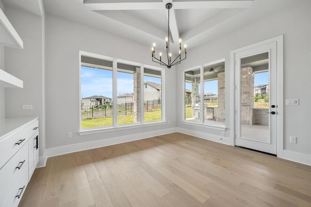 917 Bristol Creek Bnd, Lakeway, TX 78738 - unfurnished dining area featuring a chandelier, light wood-type flooring, and a raised ceiling